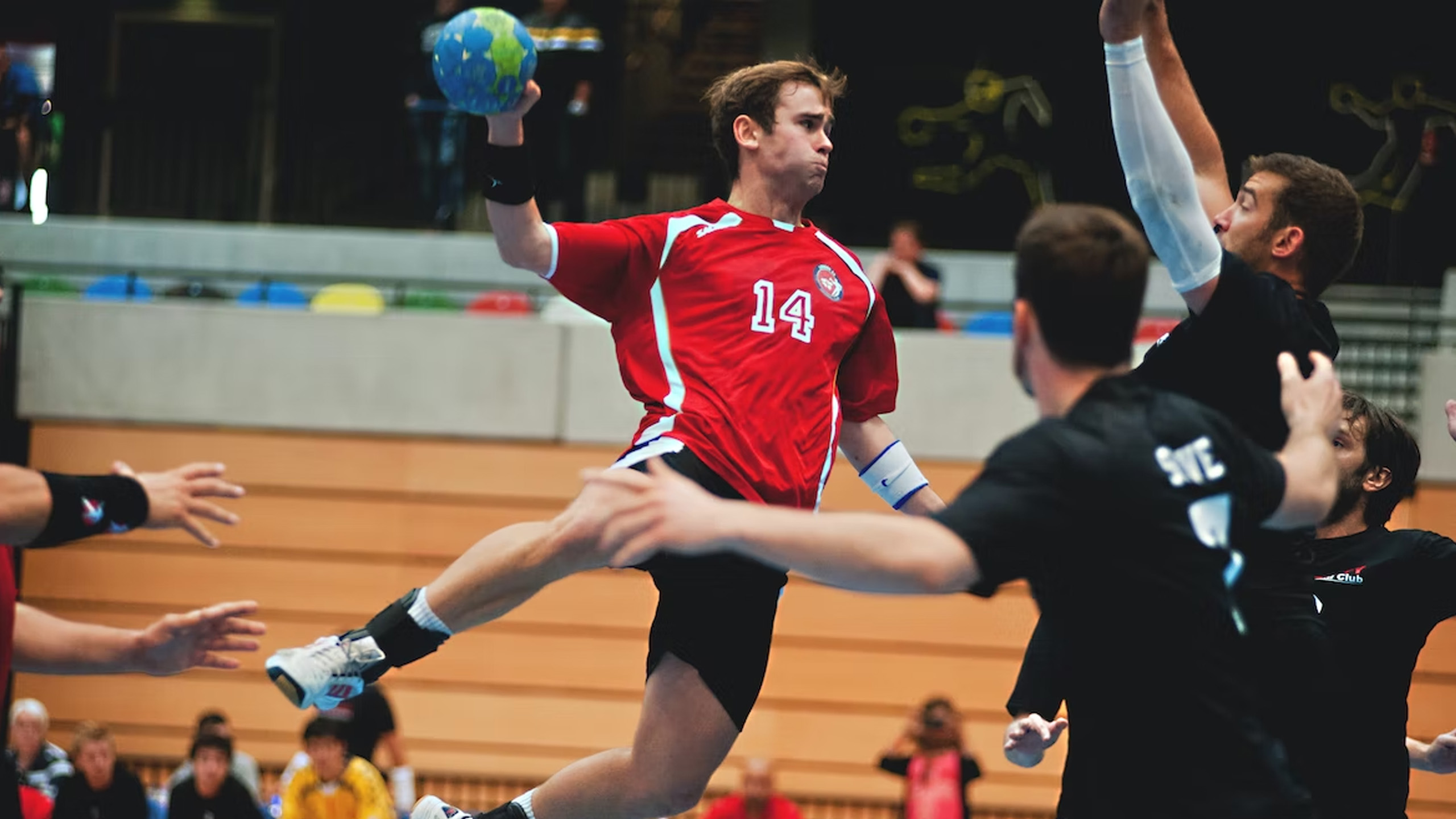 Man jumping playing handball